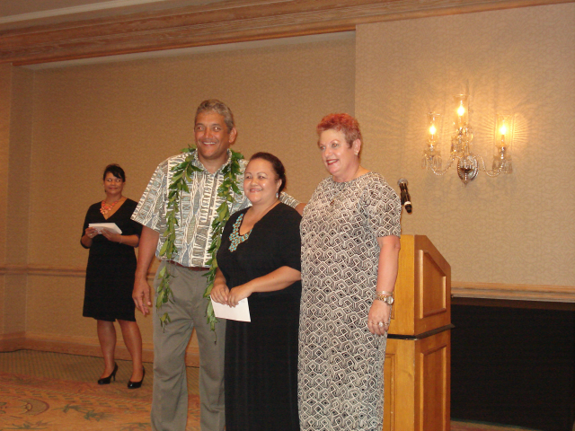 Pictured:  Big Island Mayor Billy Kenoi presents check to AILH ED Roxanne Bolden and Big Island Senior IL Specialist, Sam Nagasawa.