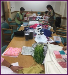 Photo of Liv! Zentangles members sorting fabric