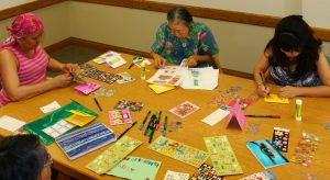 Photo of Hui Malama Po`o members making cards