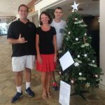 Photo of Brian, Kathleen, and Christopher in front of tree