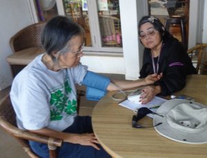 Photo of Lenora and Val Doing Blood Pressure Checks