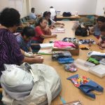 Photo of LivZen members working on sewing projects