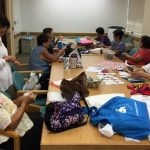 Photo of LivZen members working on sewing projects