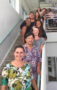 Photo of entire staff standing on stairwell during Staff Training in Hilo