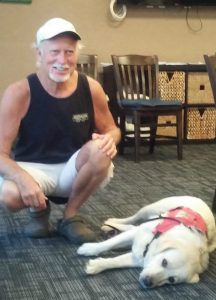 Photo of Hawaii Fi-Do consumer with his service dog