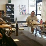 Photo of Maui Peer Support Group sitting around conference table