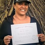 Photo of JulieAnn Agliam holding certificate
