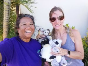 Photo of Lani and woman with stuffed animals