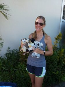 Photo of woman holding some stuffed animals