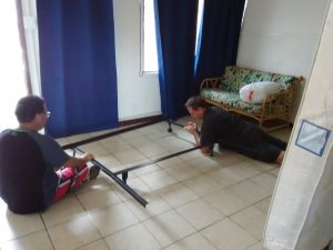 Photo of men setting up bed frame