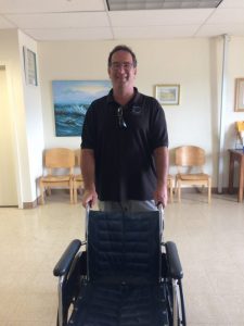 Photo of Brian delivering wheelchair