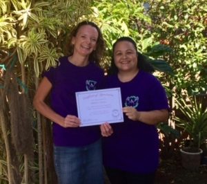 Photo of Kathleen and Roxanne holding anniversary certificate