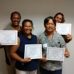 Photo of Julie, Lani, Tom, and Karin holding certificates