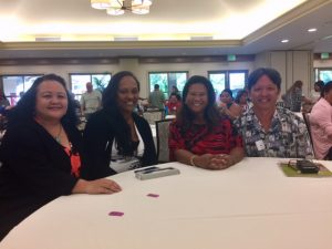 Photo of Roxanne, Julie, Lani, and Tom at the Homelessness Conference