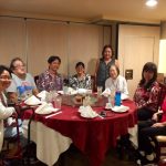 Photo of Hui Malama Po`o sitting around table at holiday luncheon