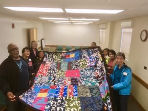 Photo of Liv Zen group holding elephant blanket