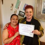 Photo of Roxanne and Sam holding anniversary certificate